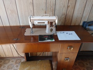 Singer Sewing Machine and Cabinet with Stool, drawers are filled with sewing supplies